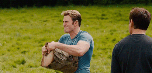 a gif of Chris Evans breaking a log in half